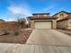 Charming home featuring a two-car garage, low-maintenance landscaping, and a cozy, inviting facade at 6228 Grace Mountain St, Las Vegas, NV 89115
