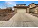 Charming home featuring a two-car garage, low-maintenance landscaping, and a cozy, inviting facade at 6228 Grace Mountain St, Las Vegas, NV 89115