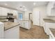 A spacious kitchen with granite countertops, white cabinets, and stainless steel appliances at 6228 Grace Mountain St, Las Vegas, NV 89115