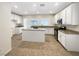 Bright kitchen featuring an island, modern stainless steel appliances, and plentiful cabinet space at 6228 Grace Mountain St, Las Vegas, NV 89115