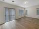 Bright and open living room with wood floors and sliding glass doors at 6228 Grace Mountain St, Las Vegas, NV 89115