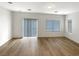 Bright and open living room with wood floors and sliding glass doors at 6228 Grace Mountain St, Las Vegas, NV 89115