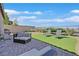 Relaxing backyard with well manicured lawn, patio, and outdoor seating, perfect for enjoying sunny days at 6232 Lautman Ridge Ct, Las Vegas, NV 89141