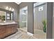 Contemporary bathroom with a glass shower, tile floors, and vanity with double sinks at 6232 Lautman Ridge Ct, Las Vegas, NV 89141