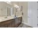 Bathroom features a double vanity, modern lighting, and contemporary decor at 6232 Lautman Ridge Ct, Las Vegas, NV 89141