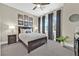 Bedroom featuring ample natural light, stylish decor, ceiling fan, and carpeted floors at 6232 Lautman Ridge Ct, Las Vegas, NV 89141