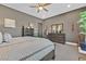 Relaxing bedroom with brown furniture, neutral walls and carpet, and stylish decor at 6232 Lautman Ridge Ct, Las Vegas, NV 89141