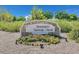 Inzalaco Gathering Park entrance sign amidst colorful flower beds and mature trees, creating a welcoming environment at 6232 Lautman Ridge Ct, Las Vegas, NV 89141