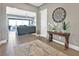 Elegant foyer with tiled flooring, a decorative table, and an open view to the living room at 6232 Lautman Ridge Ct, Las Vegas, NV 89141