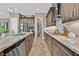 Well-equipped kitchen featuring granite counters, stainless steel appliances, gas cooktop, and convenient pantry at 6232 Lautman Ridge Ct, Las Vegas, NV 89141