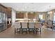 Modern kitchen with a large island, pendant lighting, stainless steel appliances, and ample cabinet space at 6232 Lautman Ridge Ct, Las Vegas, NV 89141