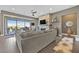 Cozy living room featuring a fireplace, plush sofa, and sliding glass doors to the patio at 6232 Lautman Ridge Ct, Las Vegas, NV 89141