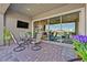 Spacious patio offering seamless indoor-outdoor living, complete with comfortable seating at 6232 Lautman Ridge Ct, Las Vegas, NV 89141