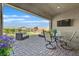 Covered patio featuring comfortable seating and a view of the backyard at 6232 Lautman Ridge Ct, Las Vegas, NV 89141