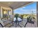 Covered patio with an outdoor dining table and a view of the serene backyard at 6232 Lautman Ridge Ct, Las Vegas, NV 89141