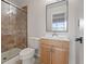 Bathroom featuring tiled shower, toilet and vanity at 7181 Pleasant View Ave, Las Vegas, NV 89147