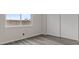 Bedroom featuring gray floors and a large window at 7181 Pleasant View Ave, Las Vegas, NV 89147