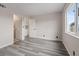 Bedroom featuring gray floors and a large window and closet at 7181 Pleasant View Ave, Las Vegas, NV 89147