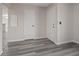 The light and airy entry showcasing the flooring and the doorways to other rooms at 7181 Pleasant View Ave, Las Vegas, NV 89147