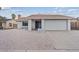 Charming single-story home featuring a two car garage and low maintenance desert landscaping at 7181 Pleasant View Ave, Las Vegas, NV 89147