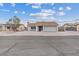 Exterior shot of charming single-story home with desert landscaping and two car garage at 7181 Pleasant View Ave, Las Vegas, NV 89147