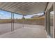 Backyard patio features a covered seating area, gravel, and block wall at 7181 Pleasant View Ave, Las Vegas, NV 89147