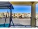 Balcony with a swing and an open view of the neighborhood on a sunny day at 7609 Trimming Ct, Las Vegas, NV 89149