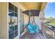 Balcony with a swing and sliding glass doors for indoor-outdoor living at 7609 Trimming Ct, Las Vegas, NV 89149