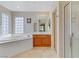 This bright bathroom features a soaking tub, tile floors, and a glass-enclosed shower at 7609 Trimming Ct, Las Vegas, NV 89149