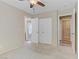 Bedroom featuring neutral walls, carpet, ceiling fan, and closet at 7609 Trimming Ct, Las Vegas, NV 89149