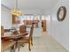 Cozy dining area with an ornate table and chairs leading to a modern kitchen at 7609 Trimming Ct, Las Vegas, NV 89149