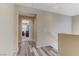 Hallway with wood flooring leading to a bedroom at 7609 Trimming Ct, Las Vegas, NV 89149