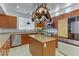 Contemporary kitchen with stainless appliances, granite counters, pendant lighting and bright natural light at 7609 Trimming Ct, Las Vegas, NV 89149