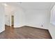 Spacious bedroom with hardwood floors, neutral walls, window and easy access to ensuite bathroom at 7722 Top Hat Ave, Las Vegas, NV 89113