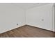 Bedroom with modern flooring, white walls and a door to the outside at 7722 Top Hat Ave, Las Vegas, NV 89113