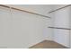 Walk-in closet with shelving and bars, offering ample storage space at 7722 Top Hat Ave, Las Vegas, NV 89113