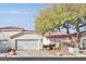Charming single-story home features a two-car garage, tile roof, and mature landscaping at 7722 Top Hat Ave, Las Vegas, NV 89113