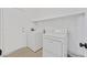 Bright laundry room featuring a washer, dryer, and storage shelf at 7722 Top Hat Ave, Las Vegas, NV 89113