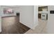 View of the living room fireplace and open access to the kitchen area at 7722 Top Hat Ave, Las Vegas, NV 89113