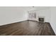 Spacious living room features dark hardwood floors, a cozy fireplace and lots of natural light at 7722 Top Hat Ave, Las Vegas, NV 89113
