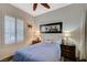 Comfortable bedroom with a full-size bed, bedside tables, and neutral decor at 8093 Luna Sera Ave, Las Vegas, NV 89178