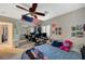 Bedroom featuring ceiling fan, mirrored closet, and bed with an American flag at 8093 Luna Sera Ave, Las Vegas, NV 89178