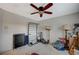 Bedroom with ceiling fan, lamp, and window with natural light at 8093 Luna Sera Ave, Las Vegas, NV 89178