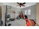 Bedroom with a ceiling fan, and window with natural light at 8093 Luna Sera Ave, Las Vegas, NV 89178