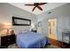 Well-lit bedroom with a comfortable bed, bedside tables, and a ceiling fan at 8093 Luna Sera Ave, Las Vegas, NV 89178