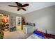 Bedroom with ceiling fan, bed, closet and doorway with natural light at 8093 Luna Sera Ave, Las Vegas, NV 89178