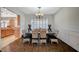 Elegant dining room with wood floors, shuttered windows, and stylish decor at 8093 Luna Sera Ave, Las Vegas, NV 89178