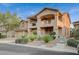 Charming two-story home with a private balcony, manicured landscaping, and neutral color palette at 8093 Luna Sera Ave, Las Vegas, NV 89178