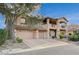Beautiful two-story home with a tile roof, multiple car garage, and serene landscaping at 8093 Luna Sera Ave, Las Vegas, NV 89178