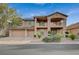 Inviting two-story home featuring a tile roof, spacious balcony, and well-maintained landscaping at 8093 Luna Sera Ave, Las Vegas, NV 89178